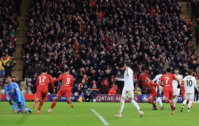 27th November 2024; Anfield, Liverpool, Merseyside, England; Champions League Football, Liverpool versus Real Madrid; Alexis MacAllister of Liverpool shoots and beats Real Madrid goalkeeper Thibaut Courtois to give his side a 1-0 lead after 52 minutes  ActionPlus12720641 DavidxBlunsden