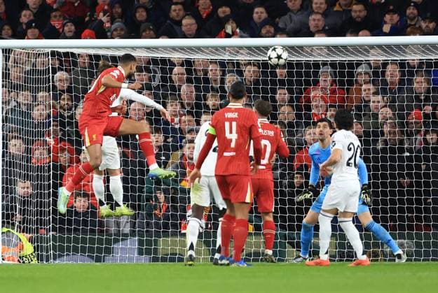 Sport Bilder des Tages Liverpool, England, 27th November 2024. Liverpool s Cody Gakpo scoring his sides second goal during the UEFA Champions League match at Anfield, Liverpool. Picture credit should read: Jessica Hornby Sportimage EDITORIAL USE ONLY. No use with unauthorised audio, video, data, fixture lists, club league logos or live services. Online in-match use limited to 120 images, no video emulation. No use in betting, games or single club league player publications. SPI-3486-0094
