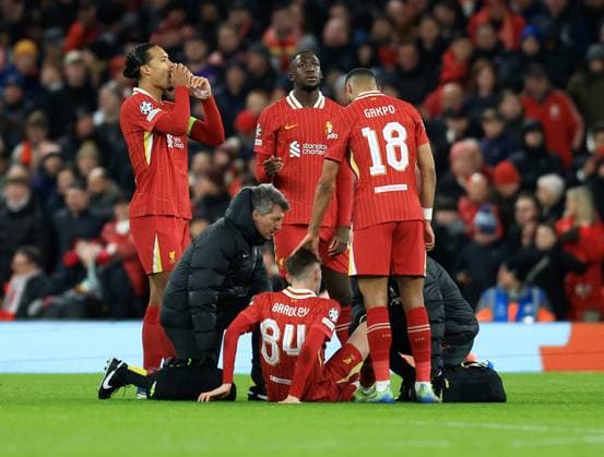 Liverpool, England, 27th November 2024. Liverpool s Conor Bradley gets injured during the UEFA Champions League match at Anfield, Liverpool. Picture credit should read: Jessica Hornby Sportimage EDITORIAL USE ONLY. No use with unauthorised audio, video, data, fixture lists, club league logos or live services. Online in-match use limited to 120 images, no video emulation. No use in betting, games or single club league player publications. SPI-3486-0105