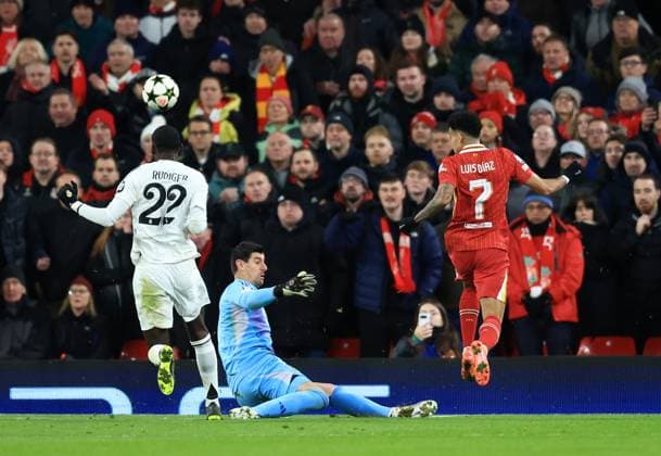 Birmingham, England, 27th November 2024. Liverpool™s Luis Diaz sees his shot saved by Real Madrid™s goalkeeper Thibaut Courtois during the UEFA Champions League match at Villa Park, Birmingham. Picture credit should read: Andrew Yates Sportimage EDITORIAL USE ONLY. No use with unauthorised audio, video, data, fixture lists, club league logos or live services. Online in-match use limited to 120 images, no video emulation. No use in betting, games or single club league player publications. SPI-3485-0037