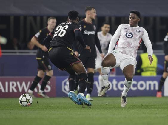 CALCIO - UEFA Champions League - Bologna FC vs LOSC Lille Jonathan David of LOSC Lille and Jhon Lucumi of Bologna FC during the Uefa Champions league 2024 25, , football match between Bologna FC and LOSC Lille on 27 November 2024 at â??â??Renato Dallâ??Araâ??â?? Stadium, Bologna, Italy, Photo Nderim Kaceli Bologna Italy  Copyright: xIPAxSport ABACAx