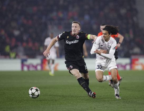 CALCIO - UEFA Champions League - Bologna FC vs LOSC Lille Ayyoub Bouaddi of LOSC Lille and Lewis Ferguson of Bologna FC during the Uefa Champions league 2024 25, , football match between Bologna FC and LOSC Lille on 27 November 2024 at â??â??Renato Dallâ??Araâ??â?? Stadium, Bologna, Italy, Photo Nderim Kaceli Bologna Italy  Copyright: xIPAxSport ABACAx