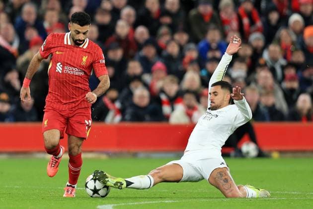 27th November 2024; Anfield, Liverpool, Merseyside, England; Champions League Football, Liverpool versus Real Madrid; Mohammed Salah of Liverpool is tackled by Dani Ceballos of Real Madrid  ActionPlus12720743 DavidxBlunsden