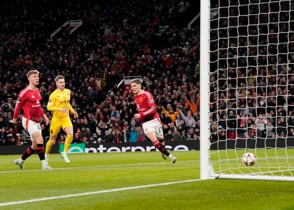 Manchester, England, 28th November 2024. Alejandro Garnacho of Manchester United, ManU scores the first goal during the UEFA Europa League match at Old Trafford, Manchester. Picture credit should read: Andrew Yates Sportimage EDITORIAL USE ONLY. No use with unauthorised audio, video, data, fixture lists, club league logos or live services. Online in-match use limited to 120 images, no video emulation. No use in betting, games or single club league player publications. SPI-3487-0018