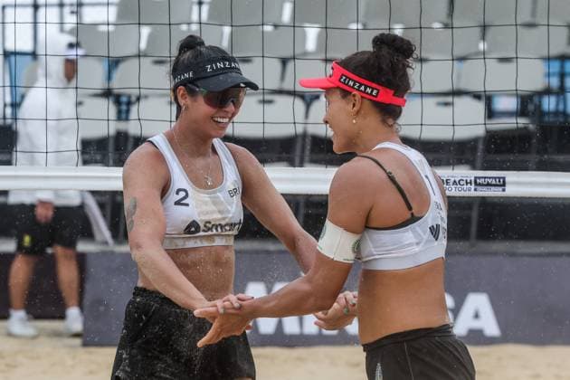 (241129) -- LAGUNA, Nov. 29, 2024 -- Taina Silva Bigi (R) and Andressa Calvacanti Ramalho of Brazil celebrate after scoring a point during the women s pool C match between Brazil and the United States at the 2024 Volleyball World Beach Pro Tour Challenge in Laguna Province, the Philippines, Nov. 29, 2024. ) (SP)PHILIPPINES-LAGUNA PROVINCE-VOLLEYBALL WORLD BEACH PRO TOUR CHALLENGE RouellexUmali 