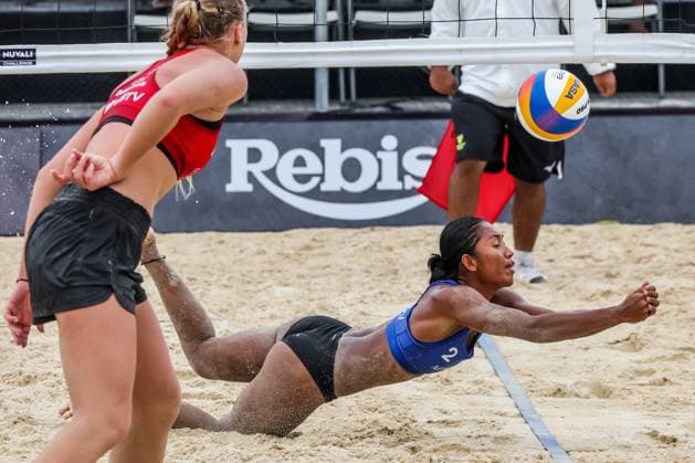 (241129) -- LAGUNA PROVINCE, Nov. 29, 2024 -- Mary Klymince Orillaneda (R) of the Philippines tries to save the ball during the women s pool F match between Lithuania and the Philippines at the 2024 Volleyball World Beach Pro Tour Challenge in Laguna Province, the Philippines on Nov. 29, 2024. ) (SP)PHILIPPINES-LAGUNA PROVINCE-VOLLEYBALL WORLD BEACH PRO TOUR CHALLENGE ROUELLExUMALI 