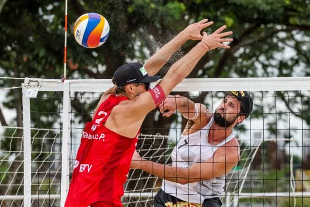 (241129) -- LAGUNA PROVINCE, Nov. 29, 2024 -- Christoph Dressler (R) of Austria competes against Paul Pascariuc of Austria during the men s pool A match between Paul Pascariuc Alexander Horst of Austria and Christoph Dressler Tim Berger of Austria at the 2024 Volleyball World Beach Pro Tour Challenge in Laguna Province, the Philippines, Nov. 29, 2024. ) (SP)PHILIPPINES-LAGUNA PROVINCE-VOLLEYBALL WORLD BEACH PRO TOUR CHALLENGE RouellexUmali 