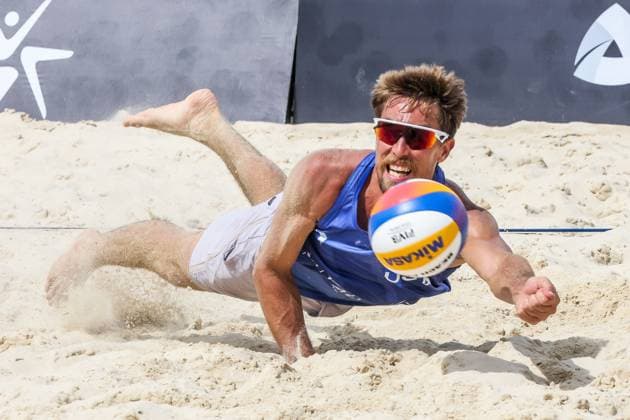 (241129) -- LAGUNA PROVINCE, Nov. 29, 2024 -- Taylor Crabb of the United States tries to save the ball during the men s pool D match between France and the United States at the 2024 Volleyball World Beach Pro Tour Challenge in Laguna Province, the Philippines, Nov. 29, 2024. ) (SP)PHILIPPINES-LAGUNA PROVINCE-VOLLEYBALL WORLD BEACH PRO TOUR CHALLENGE RouellexUmali 