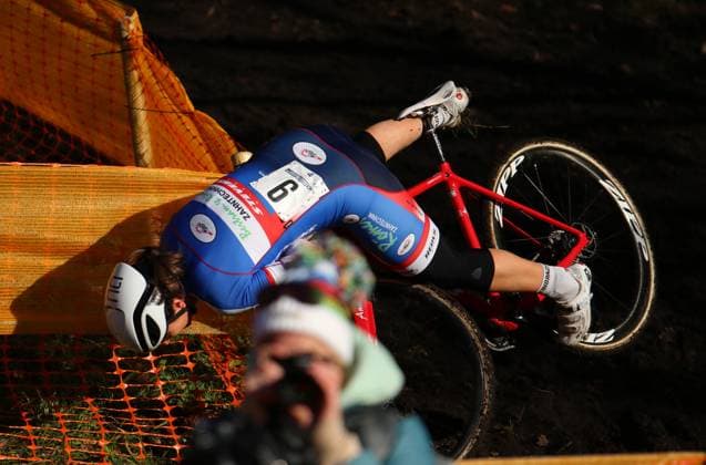 Cyclo-cross World Masters Championships in Hamburg A competitor gets stuck on a boundary post on a downhill run and falls down