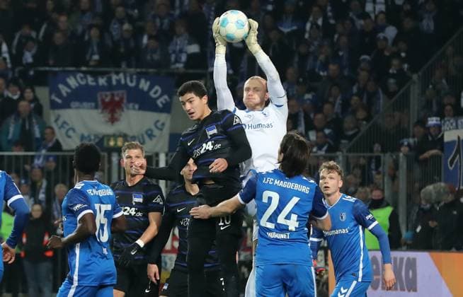 Goalkeeper Dominik Reimann catches the ball from Ibrahim Maza duel Match scene Action Sport Football Soccer 2 Bundesliga Men 14 Matchday Season 2024 2025 29 11 2024 1 FC Magdeburg FCM vs Hertha BSC Berlin DFL regulations prohibit any use of photographs as image sequences and or quasi video