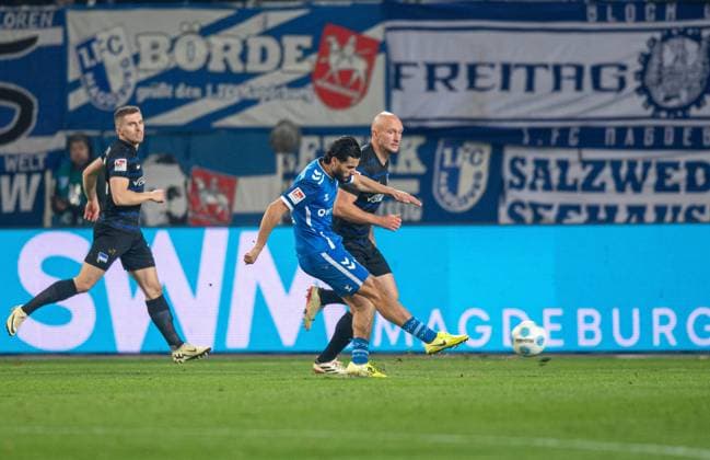 Soccer, Men, Season 2024 2025, 2 Bundesliga 14 Matchday , 1 FC Magdeburg Hertha BSC, Mohammed El Hankouri 1 FC Magdeburg scores the goal for 1 0 against Toni Leistner Hertha BSC , 29 11 2024, Copyright: xSebastianxRäppold MatthiasxKochx