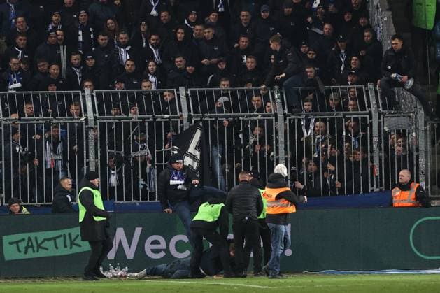A fan of 1 FC Magdeburg runs to the fan block of Hertha BSC Berlin after the game, he is stopped by stewards just before the fan block 2 Soccer Bundesliga season 2024 2025 1 FC Magdeburg vs Hertha BSC Berlin at the Avnet Arena in Magdeburg Soccer,Man,Men,Germany,29 11 2024