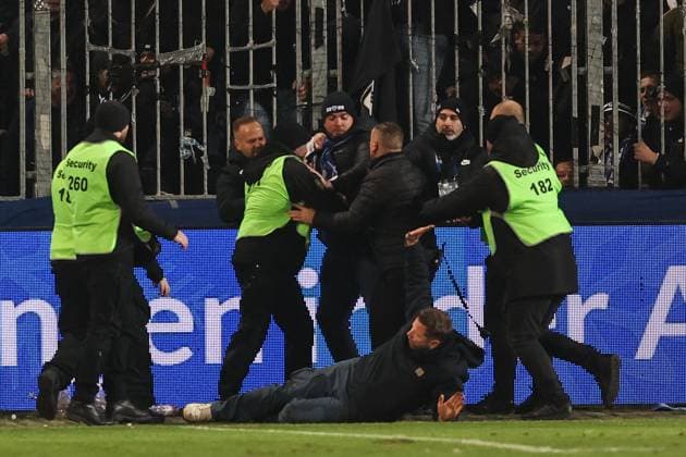 A fan of 1 FC Magdeburg runs to the fan block of Hertha BSC Berlin after the game, he is stopped by stewards just before the fan block 2 Soccer Bundesliga season 2024 2025 1 FC Magdeburg vs Hertha BSC Berlin at the Avnet Arena in Magdeburg Soccer,Man,Men,Germany,29 11 2024