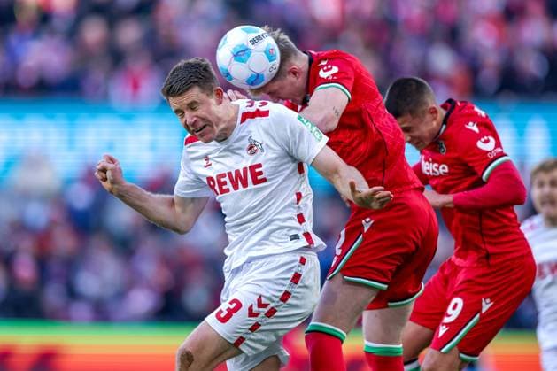30 11 2024, Football, 1 FC Köln Hannover 96, 2 Fußball Bundesliga, RheinEnergieSTADION, Saison 2024 2025 Zweikampf Kopfball Dominique Heintz 1 FC Köln 3 gegen Josh Knight Hannover 2 und Nicolo Tresoldi Hannover 9 DFB regulations prohibit any use of photographs as image sequences and or quasi video Nordrhein Westfalen Germany