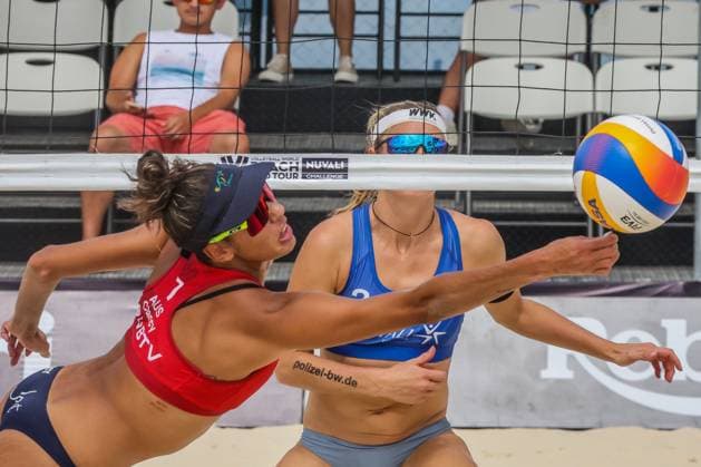 (241130) -- LAGUNA PROVINCE, Nov. 30, 2024 -- Taliqua Clancy (Front) of Australia competes against Kim Van de Velde of Germany during the women s round of 18 match between the Germany and Australia at the 2024 Volleyball World Beach Pro Tour Challenge in Laguna Province, the Philippines on Nov. 30, 2024. ) (SP)PHILIPPINES-LAGUNA PROVINCE-VOLLEYBALL WORLD BEACH PRO TOUR CHALLENGE ROUELLExUMALI 
