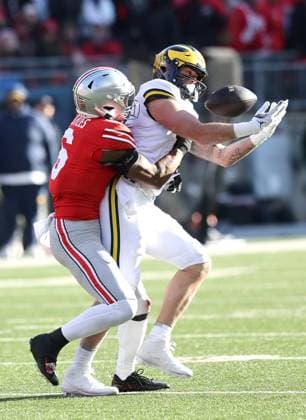 Michigan Wolverines Marlin Klein (17) makes a catch as he is hit by Ohio State Buckeyes Sonny Styles (6) in the fourth quarter in Columbus, Ohio on Saturday, November 30, 2024.  COL20241130125 AaronxJosefczyk