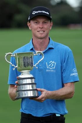 GOLF AUSTRALIAN OPEN, Ryggs Johnston poses for a photo with the winners trophy at the conclusion of day four of the ISPS HANDA Australian Open at Kingston Heath Golf Club in Melbourne, Sunday, December 1, 2024. ( NO ARCHIVING, EDITORIAL USE ONLY, NO USE IN BOOKS WITHOUT CONSENT MELBOURNE VICTORIA AUSTRALIA  Copyright: xCONxCHRONISx 20241201190354088969