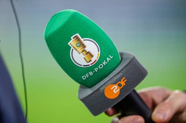 04 12 2024, Football, 1 FC Köln Hertha BSC, Round of 16 DFB Pokal, RheinEnergieSTADION, Season 2024 2025 Feature close-up microphone, ZDF, Interview TV broadcast moderation detail photo detail logo emblem symbol image symbol photo DFB regulations prohibit any use of photographs as image sequences and or quasi video Nordrhein Westfalen Germany