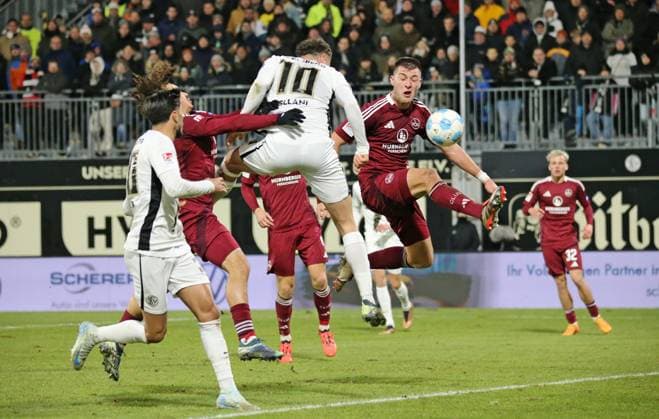 06 12 2024, xmohx, Soccer 2 Bundesliga, SV Elversberg 1 FC Nürnberg emspor, v l Header chance from Fisnik Asllani Elversberg against Robin Knoche Nürnberg DFL DFB REGULATIONS PROHIBIT ANY USE OF PHOTOGRAPHS as IMAGE SEQUENCES and or QUASI VIDEO Elversberg