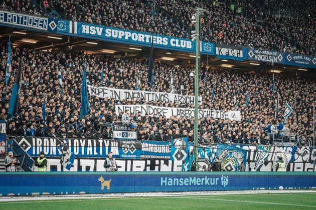 Soccer Men Season 2024 2025 2 Football Bundesliga 15 Matchday Hamburger SV vs SV Darmstadt 98 08 12 2024 HSV fans with a banner Head In Infantinos ass Neuendorf talking shit, criticism of DFB and FIFA World Cup award Saudi Arabia Hamburg Volksparkstadion Hamburg Germany