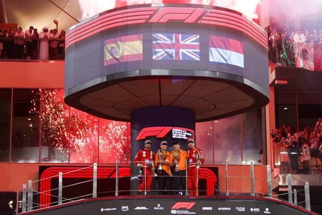 December 8, 2024, Abu Dhabi, United Arab Emirates: Lando Norris of McLaren, Carlos Sainz of Ferrari, Charles Leclerc of Ferrari and and Zak Brown of McLaren celebrate on the podium during Formula 1 Abu Dhabi Grand Prix at Yas Marina Circuit on December 8th, 2024 in Abu Dhabi, United Arab Emirates. Abu Dhabi United Arab Emirates - ZUMAz156 0783737390st Copyright: xBeataxZawrzelx