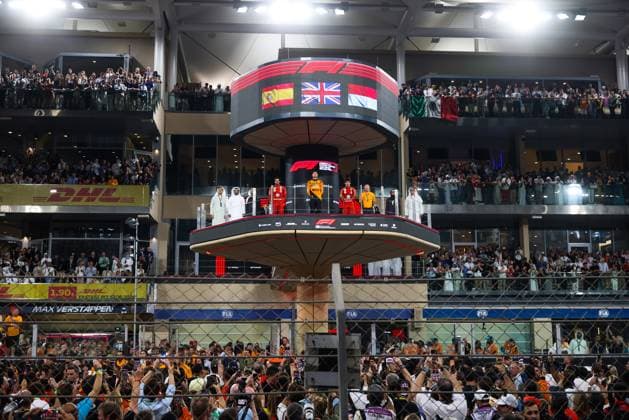 December 8, 2024, Abu Dhabi, United Arab Emirates: Lando Norris of McLaren, Carlos Sainz of Ferrari, Charles Leclerc of Ferrari and and Zak Brown of McLaren celebrate on the podium during Formula 1 Abu Dhabi Grand Prix at Yas Marina Circuit on December 8th, 2024 in Abu Dhabi, United Arab Emirates. Abu Dhabi United Arab Emirates - ZUMAz156 0783737398st Copyright: xBeataxZawrzelx