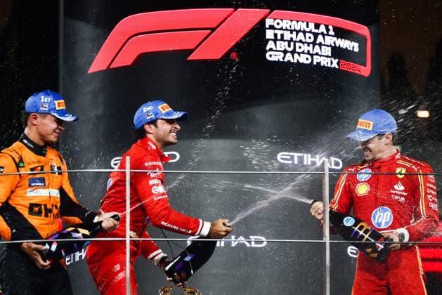 December 8, 2024, Abu Dhabi, United Arab Emirates: Lando Norris of McLaren, Carlos Sainz of Ferrari and Charles Leclerc of Ferrari celebrate on the podium during Formula 1 Abu Dhabi Grand Prix at Yas Marina Circuit on December 8th, 2024 in Abu Dhabi, United Arab Emirates. Abu Dhabi United Arab Emirates - ZUMAz156 0783737757st Copyright: xBeataxZawrzelx