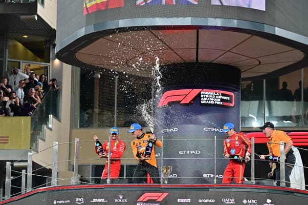 Formula 1 Etihad Airways Abu Dhabi Grand Prix 2024 08 12 2024, Yas Marina Circuit, Abu Dhabi, Formula 1 Etihad Airways Abu Dhabi Grand Prix 2024 , in the picture podium , winner Lando Norris GBR , McLaren F1 Team, 2nd place for Carlos Sainz Jr ESP , Scuderia Ferrari HP, 3rd place for Charles Leclerc MCO , Managing Director Zak Brown McLaren Formula 1 Team nordphotoxGmbHx xBratic nph00250