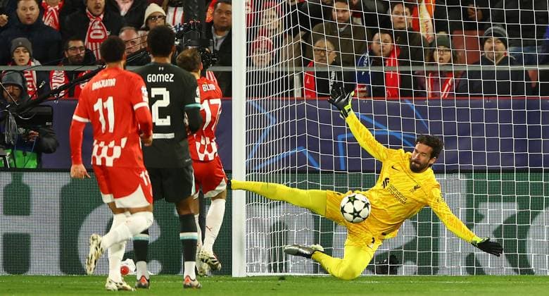 Alisson Becker of Liverpool makes a save from Daley Blind of Girona Girona v Liverpool, UEFA Champions League, Group Stage, Football, Estadi Montilivi, Girona, Spain - 10 Dec 2024 EDITORIAL USE ONLY No use with unauthorised audio, video, data, fixture lists, club league logos or live services. Online in-match use limited to 120 images, no video emulation. No use in betting, games or single club league player publications.  Copyright: xKieranxMcManus Shutterstockx 14984460r