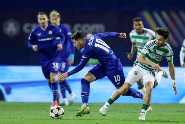 GNK Dinamo v Celtic FC - UEFA Champions League 2024 25 League Phase MD6 ZAGREB, CROATIA - DECEMBER 10: Martin Baturina of Dinamo Zagreb is challenged by Nicolas Kuhn of Celtic during UEFA Champions League League Phase MD6 match between Dinamo Zagreb and Celtic at Stadion Maksimir on December 10, 2024 in Zagreb, Croatia.  SanjinxStrukic PIXSELL