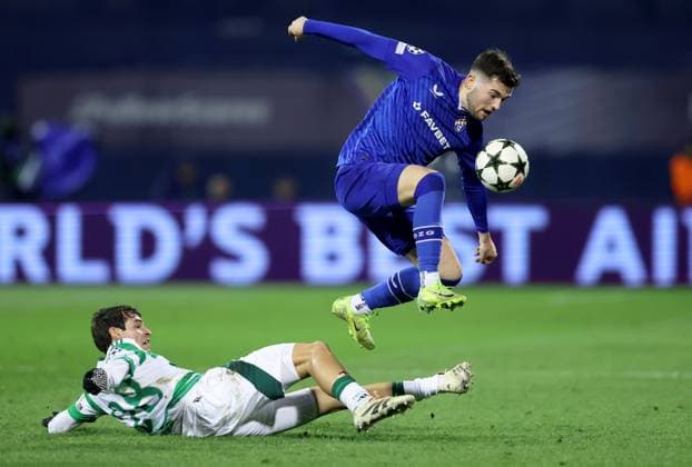 GNK Dinamo v Celtic FC - UEFA Champions League 2024 25 League Phase MD6 ZAGREB, CROATIA - DECEMBER 10: Martin Baturina of Dinamo Zagreb is challenged by Paulo Bernardo of Celtic during UEFA Champions League League Phase MD6 match between Dinamo Zagreb and Celtic at Stadion Maksimir on December 10, 2024 in Zagreb, Croatia.  SanjinxStrukic PIXSELL