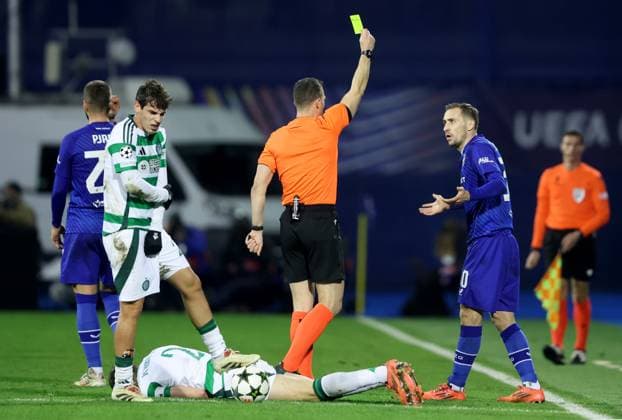GNK Dinamo v Celtic FC - UEFA Champions League 2024 25 League Phase MD6 ZAGREB, CROATIA - DECEMBER 10: Marko Rog of Dinamo Zagreb is shown a yellow card by Referee Felix Zwayer during UEFA Champions League League Phase MD6 match between Dinamo Zagreb and Celtic at Stadion Maksimir on December 10, 2024 in Zagreb, Croatia.  SanjinxStrukic PIXSELL
