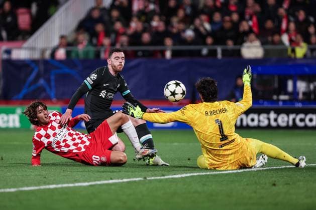 December 10, 2024, Girona, Girona, SPAIN: Bryan Gil of Girona FC, Andrew Robertson and Alisson Becker of Liverpool FC in action during the UEFA Champions League 2024 25 League Phase MD6, match between Girona FC and Liverpool FC at Estadi de Montilivi on December 10, 2024 in Girona, Spain. Girona SPAIN - ZUMAa181 20241210_zaa_a181_070 Copyright: xJavierxBorregox