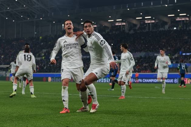 Bergamo, Italy, 10th December 2024. Jude Bellingham of Real Madrid celebrates with team mate Lucas Vazquez after scoring to give the side a 3-1 lead during the UEFA Champions League match at Stadio di Bergamo, Bergamo. Picture credit should read: Jonathan Moscrop Sportimage EDITORIAL USE ONLY. No use with unauthorised audio, video, data, fixture lists, club league logos or live services. Online in-match use limited to 120 images, no video emulation. No use in betting, games or single club league player publications. SPI-3516-0023
