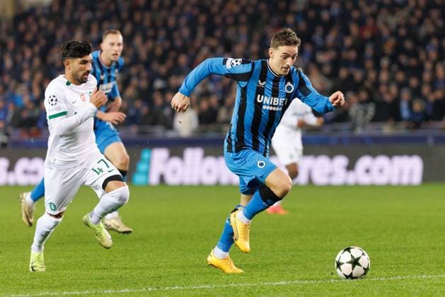 Sporting s Ricardo Esgaio and Club s Casper Nielsen fight for the ball during a soccer game between Belgian Club Brugge KV and Portuguese club Sporting CP, Tuesday 10 December 2024 in Brugge, on the sixth day of the UEFA Champions League league phase. KURTxDESPLENTER  x107901923x