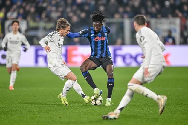 Luka Modric Real Madrid CF , Odilo Kossounou Atalanta BC and Federico Valverde Real Madrid CF battle for the ball during the UEFA Champions League 2024 25 League Phase MD6 match between Atalanta BC and Real Madrid C F at Gewiss Stadium on December 10, 2024 in Bergamo, Italy Defodi 541 BERREA20241210 083 Defodi-541