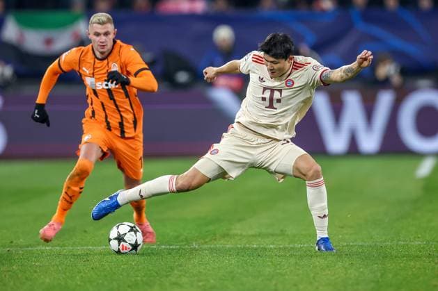 10 12 2024, Football, UEFA Champions League, Shakhtar Donetsk FC Bayern Munich, Arena AufSchalke Gelsenkirchen, 8 Matchday Season 2024 2025 Oleksandr Zubkov Shakhtar Donetsk 11 in duel against Min jae Kim Bayern 3 DFB regulations prohibit any use of photographs as image sequences and or quasi video North Rhine-Westphalia Germany