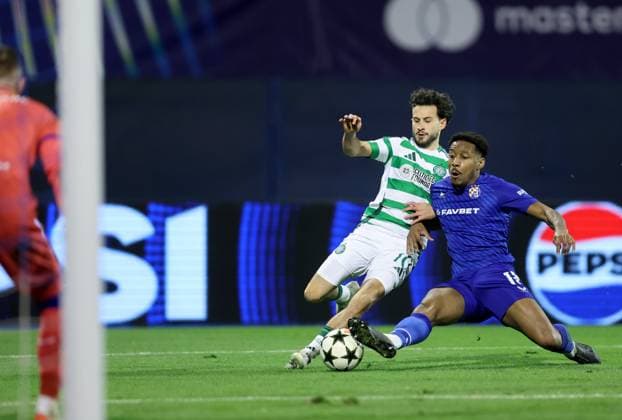 (241211) -- ZAGREB, Dec. 11, 2024 -- Nicolas Kuhn (L) of Celtic FC vies with Ronael Pierre-Gabriel of GNK Dinamo during the UEFA Champions League match between GNK Dinamo and Celtic FC in Zagreb, Croatia, Dec. 10, 2024. (Photo by PIXSELL via Xinhua) (SP)CROATIA-ZAGREB-FOOTBALL-UEFA CHAMPIONS LEAGUE-DINAMO VS CELTIC SanjinxStrukic 