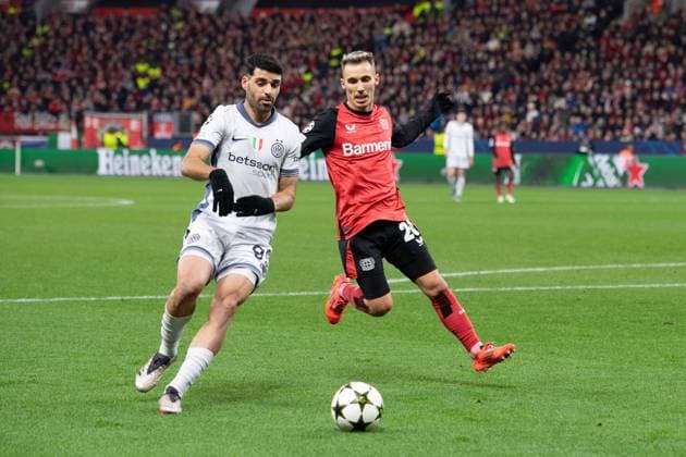 Mehdi TAREMI Inter vs Alejandro GRIMALDO LEV action, duel, Football Champions League, Matchday 6, Bayer 04 Leverkusen LEV Inter Milan Inter 1 0 on 10 12 2024 in Leverkusen Germany UEFA regulations prohibit any use of photographs as image sequences and or quasi video Â