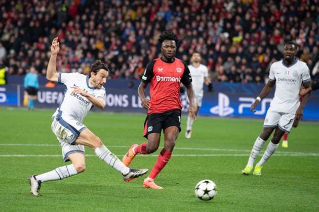 Matteo DARMIAN Inter vs Edmond TAPSOBA LEV action, duel, Football Champions League, Matchday 6, Bayer 04 Leverkusen LEV Inter Milan Inter 1 0 on 10 12 2024 in Leverkusen Germany UEFA regulations prohibit any use of photographs as image sequences and or quasi video Â