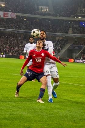 SOCCER - UEFA CL, Lille vs Sturm LILLE,FRANCE,11.DEC.24 - SOCCER - UEFA Champions League, OSC Lille vs SK Sturm Graz. Image shows Ayyoub Bouaddi (Lille) and Gregory Wuethrich (Sturm).  GEPAxpictures xAvnixRetkoceri