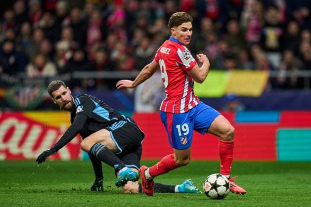Julian Alvarez of Atletico de Madrid and Kenan Bajric of SK Slovan Bratislava Atletico de Madrid v Slovan Bratislava. UEFA Champions League match. Date 6. Football, Riyadh Air Metropolitano Stadium, Madrid, Spain - 11 Dic 2024 Editorial use only  Copyright: xPRESSINPHOTO Shutterstockx 14994194v