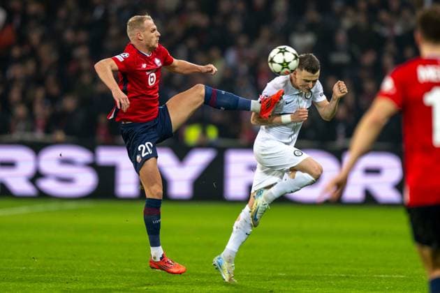 SOCCER - UEFA CL, Lille vs Sturm LILLE,FRANCE,11.DEC.24 - SOCCER - UEFA Champions League, OSC Lille vs SK Sturm Graz. Image shows Mitchel Bakker (Lille) and Dimitri Lavalee (Sturm).  GEPAxpictures xAvnixRetkoceri
