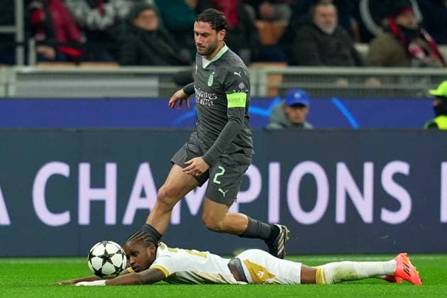 AC Milan s Davide Calabria fight for the ball with Red Star s Felicio Milson during the Uefa Champions League soccer match between Ac Milan and Crvena Zvezda at the San Siro Stadium in Milan, north Italy - Wednesday , December 11, 2024. - Soccer .  Copyright: xSpada LaPressex