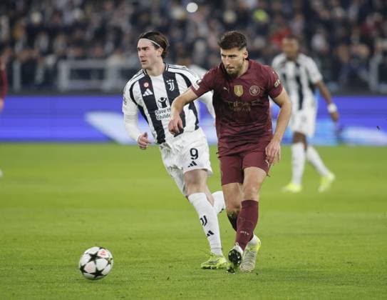 Ruben Dias of Manchester City and Dusan Vlahovic of Juventus FC during the Uefa Champions League 2024 25, football match between Juventus FC and Manchester City, on 11 December 2024, at Allianz Stadium Turin Italy. Photo Nderim Kaceli  Copyright: xNderimxKaceli IPAxSportx xipa-agency.netx xx IPA_52320902 IPA_Agency_IPA52320902
