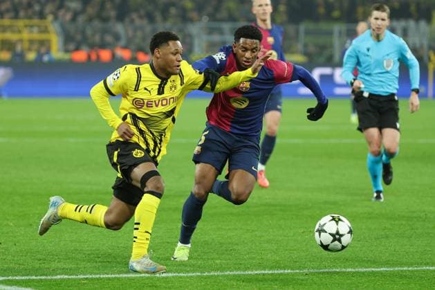 UEFA Champions League Borussia Dortmund FC Barcelona on 11 12 2024 at Signal Iduna Park in Dortmund Julien Duranville Dortmund 16 vs Alejandro Balde Barcelona 3 MH