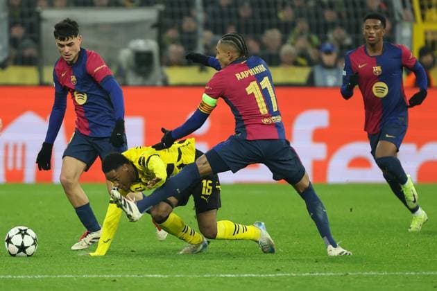 UEFA Champions League Borussia Dortmund FC Barcelona on 11 12 2024 at Signal Iduna Park in Dortmund Pedri Barcelona 8 and Raphinha Barcelona 11 vs Julien Duranville Dortmund 16 MH