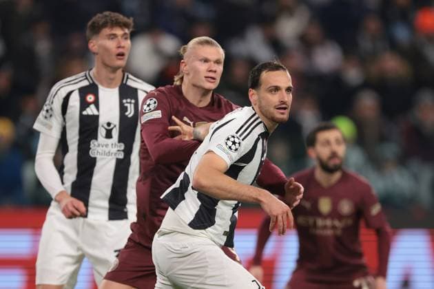 Turin, Italy, 11th December 2024. Nicolo Savona of Juventus looks on as team mate Federico Gatti keeps a clsoe guard on Erling Haaland of Manchester City during the UEFA Champions League match at Juventus Stadium, Turin. Picture credit should read: Jonathan Moscrop Sportimage EDITORIAL USE ONLY. No use with unauthorised audio, video, data, fixture lists, club league logos or live services. Online in-match use limited to 120 images, no video emulation. No use in betting, games or single club league player publications. SPI-3517-0019