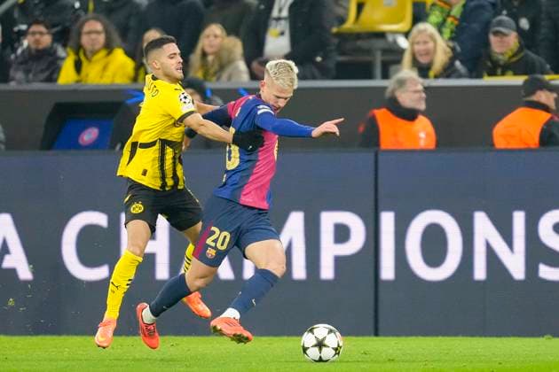 Yan Couto Borussia Dortmund and Dani Olmo FC Barcelona battle for the ball during the UEFA Champions League 2024 25 League Phase MD6 match between Borussia Dortmund and FC Barcelona at Signal Iduna Park on December 11, 2024 in Dortmund, Germany Photo by Alex Gottschalk DeFodi Images Defodi 001 BVBFCB20241211 164 Defodi-001