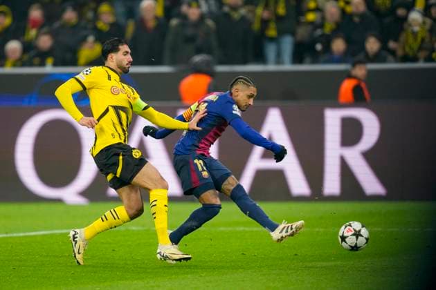 Emre Can Borussia Dortmund and Raphinha FC Barcelona battle for the ball during the UEFA Champions League 2024 25 League Phase MD6 match between Borussia Dortmund and FC Barcelona at Signal Iduna Park on December 11, 2024 in Dortmund, Germany Photo by Alex Gottschalk DeFodi Images Defodi 001 BVBFCB20241211 157 Defodi-001